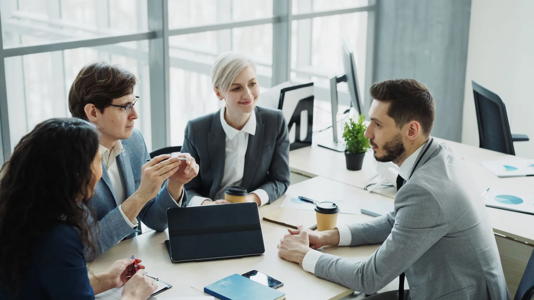 Colleagues discussing a business process around a table